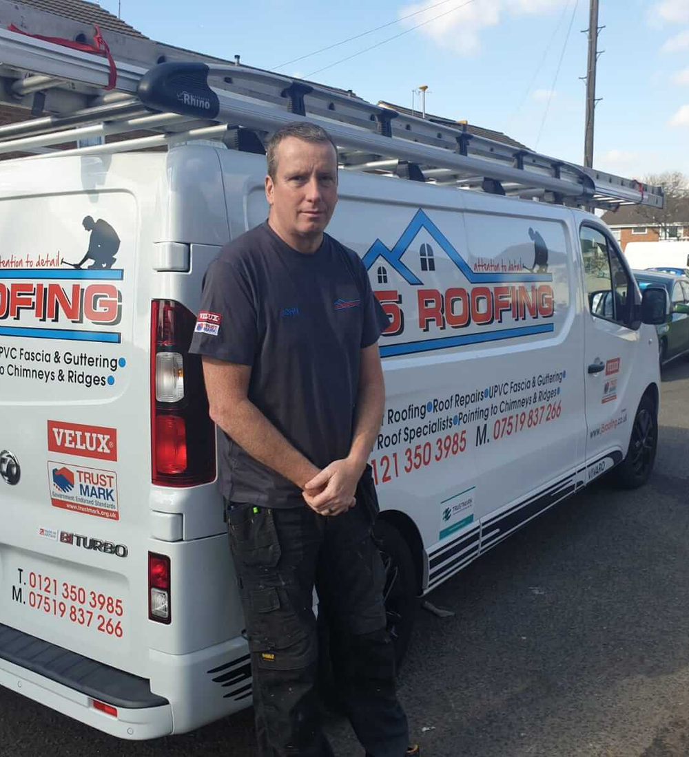 John from J5 Roofing standing beside the company's van in Erdington